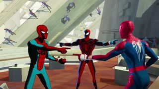 Many Spider-Men variants, including three in the foreground, point at each other in Spider-Man: Across the Spider-Verse