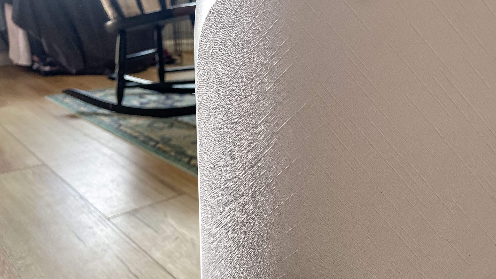 Close up of the textured shell on the Narwal Freo 20 robot vacuum dock