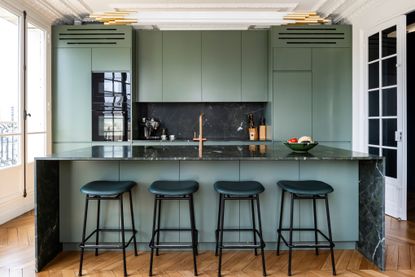 green kitchen with black