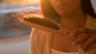 woman brushing her hair