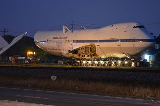 The Shuttle Carrier Aircraft arrives at the waypoint of the first leg of its two night road trip to Space Center Houston early Tuesday morning, April 29, 2014.