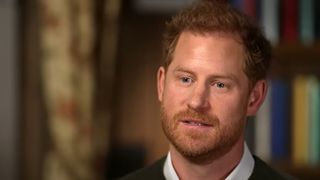 Prince Harry sitting down in Prince Harry's 60 Minutes interview special