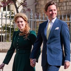 Princess Beatrice wearing a green dress holding hands with Edoardo Mapelli Mozzi outside church
