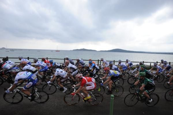 The bunch speeds along the Corsican coast