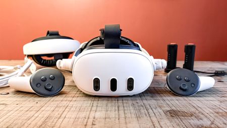 Meta Quest 3 with VR accessories on table 