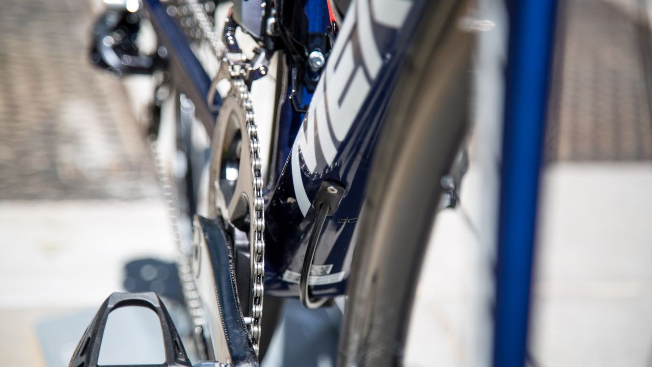 The rear brake internal cable exits underneath the downtube