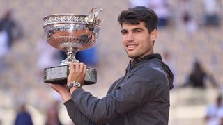 Carlos Alcaraz lifting the French Open 2024 Trophy aloft