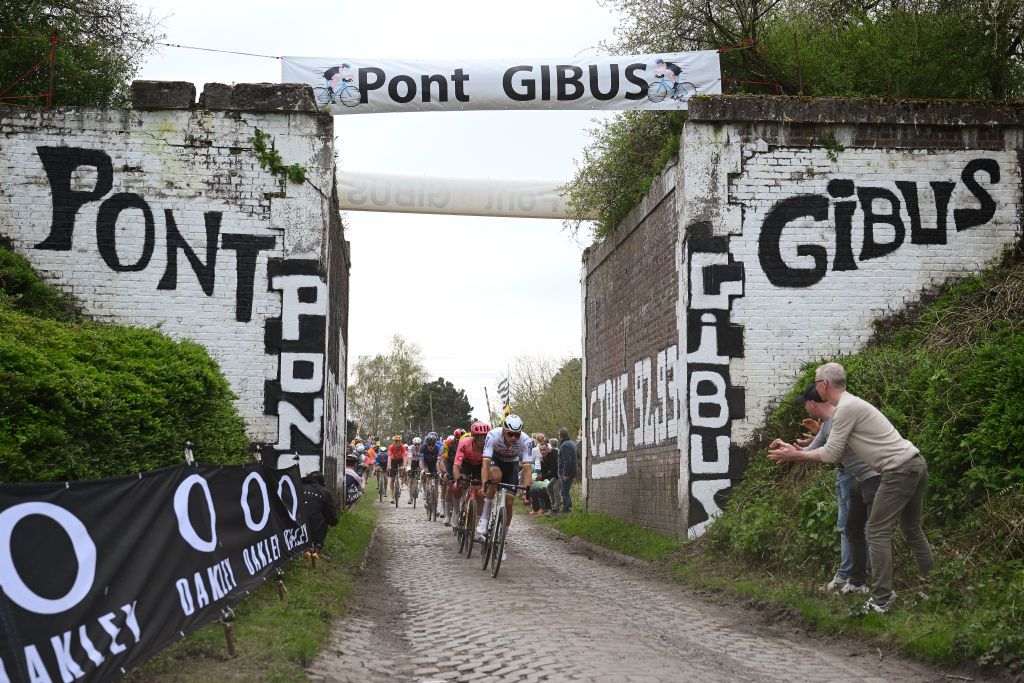 ROUBAIX FRANCE APRIL 07 LR Stefan Bissegger of Switzerland and Team EF Education EasyPost and Mathieu van der Poel of The Netherlands and Team Alpecin Deceuninck lead the peloton passing through the Gibus bridge during the 121st ParisRoubaix 2024 a 2597km one day race from Compiegne to Roubaix UCIWT on April 07 2024 in Roubaix France Photo by Dario BelingheriGetty Images