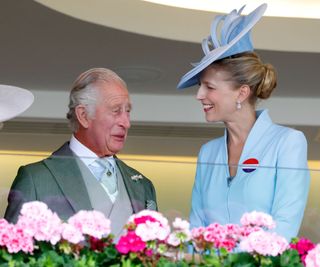 King Charles III and Lady Gabriella Windsor watch the racing from the Royal Box as they attend day 5 of Royal Ascot 2023