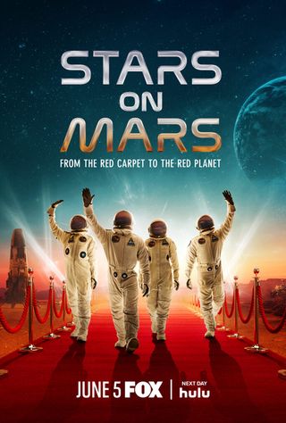 four people in space suits walk down a red carpet