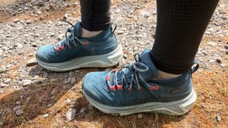 Hoka Kaha 3 Low GTX in droplet photo graphed on a hiking trail 