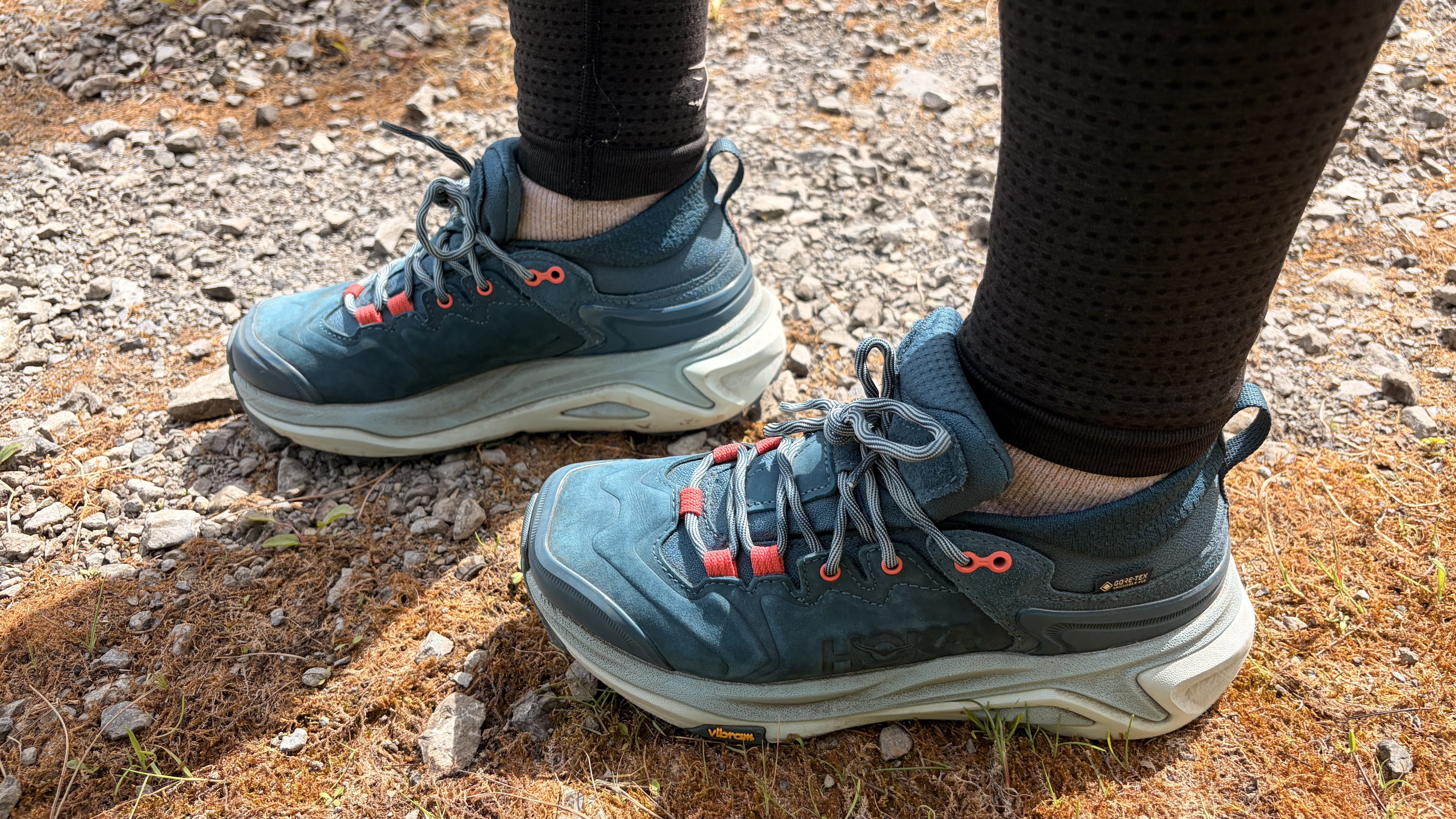 Hoka Kaha 3 Low GTX in droplet photo graphed on a hiking trail