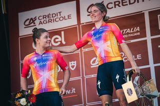 Lotte Kopecky and Demi Vollering of SD Worx on the podium of the 2023 Strade Bianche