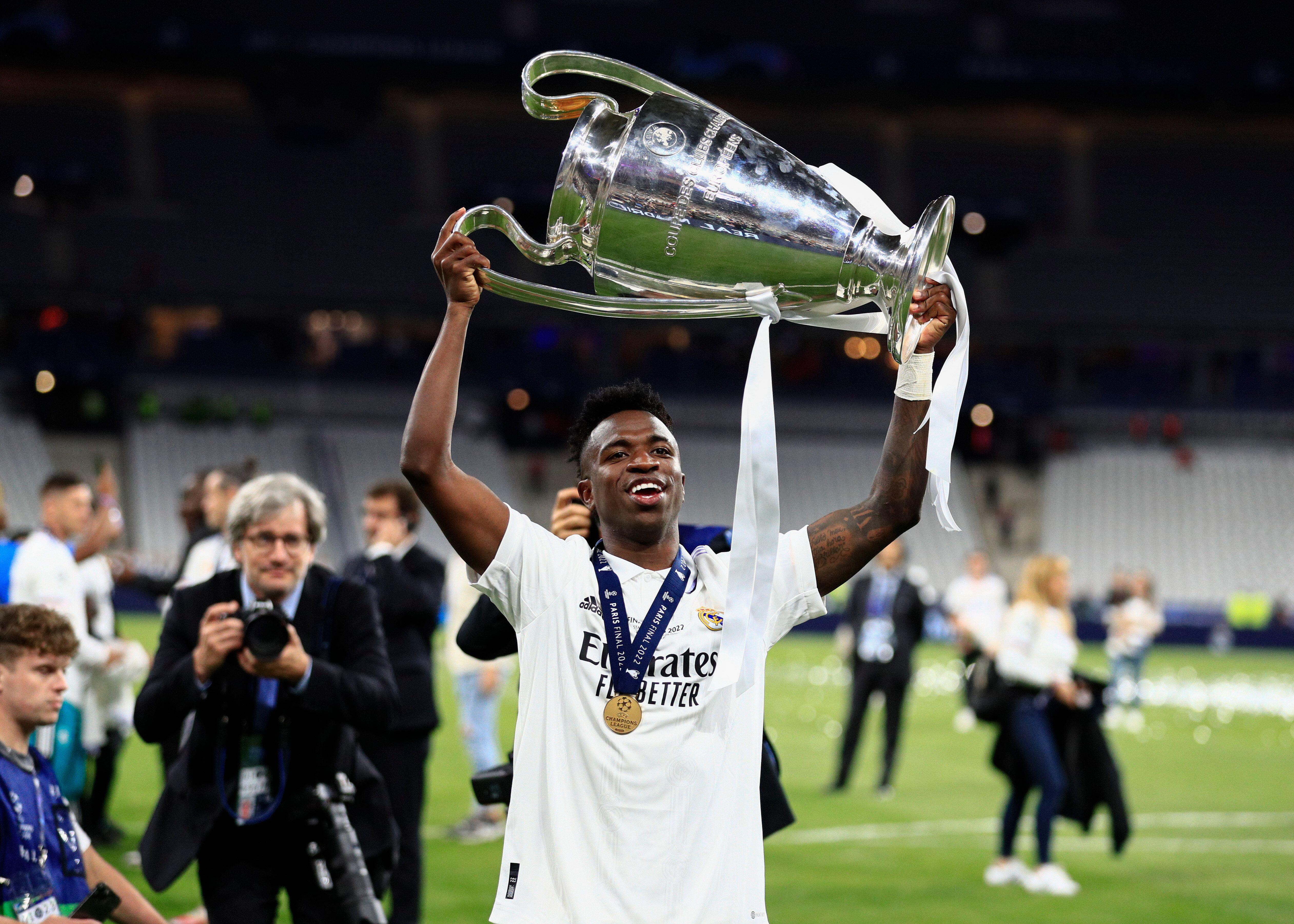 Vinicius Junior celebrates with the trophy after Real Madrid's victory over Liverpool in the 2022 Champions League final