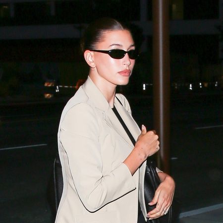 Hailey Bieber wearing a tan blazer and black pants in L.A.