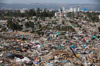 A photo taken on March 12, 2017, shows a view of Addis Ababa from the main landfill on the outskirts of the city, a day after a landslide at the dump left more than 100 people dead.