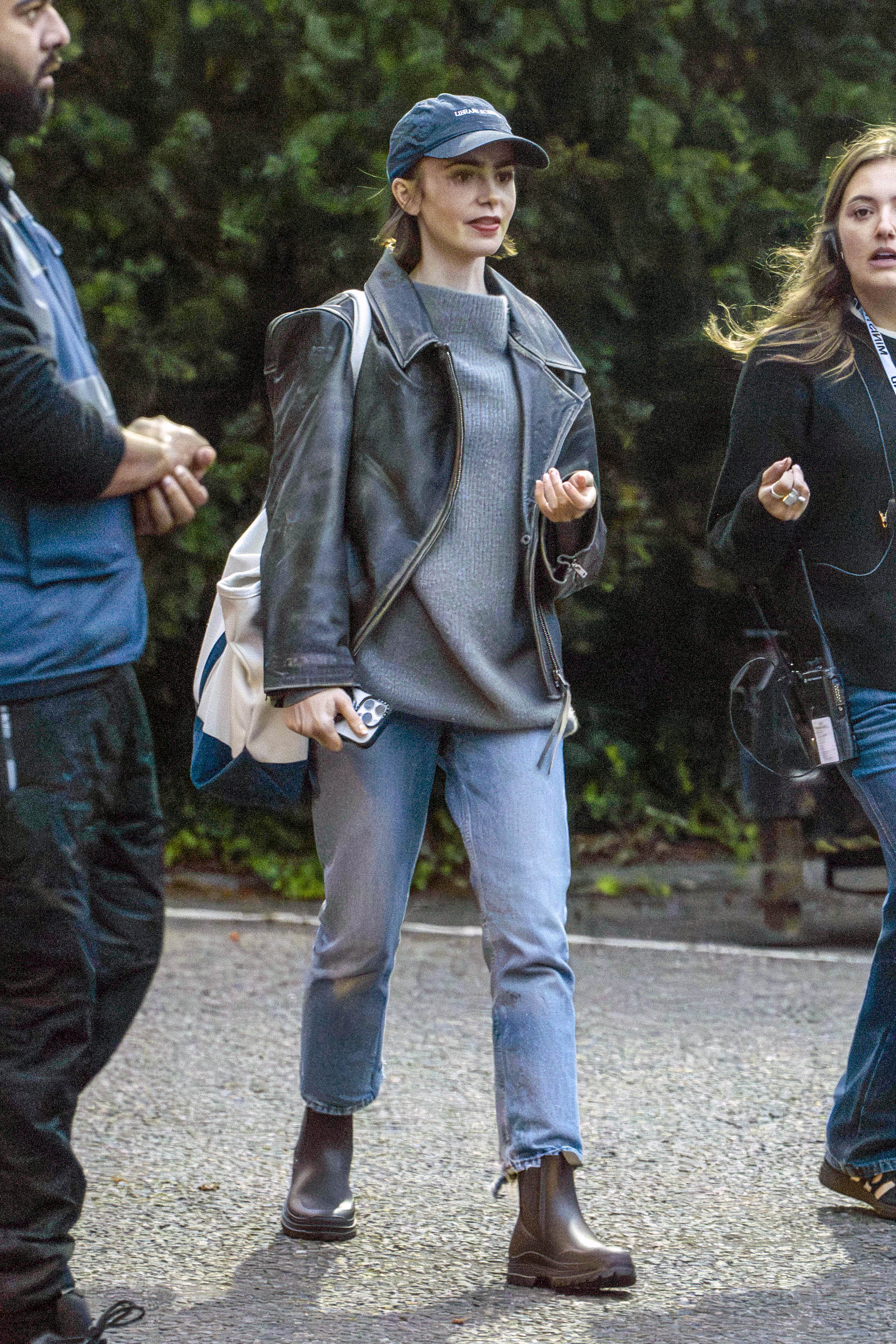 Emily In Paris star Lily Collins and her co-stars are seen leaving a day of filming in Notting Hill for the upcoming Amazon MGM film called Close Personal Friends.