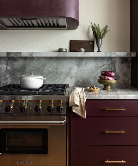 purple kitchen with Aqua Bello quartzite backsplash 