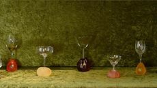 glasses arranged on green textile