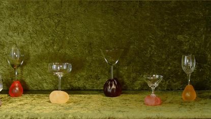 glasses arranged on green textile