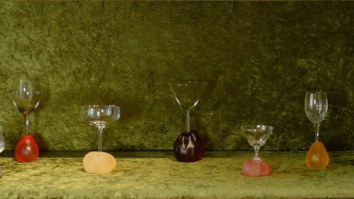 glasses arranged on green textile