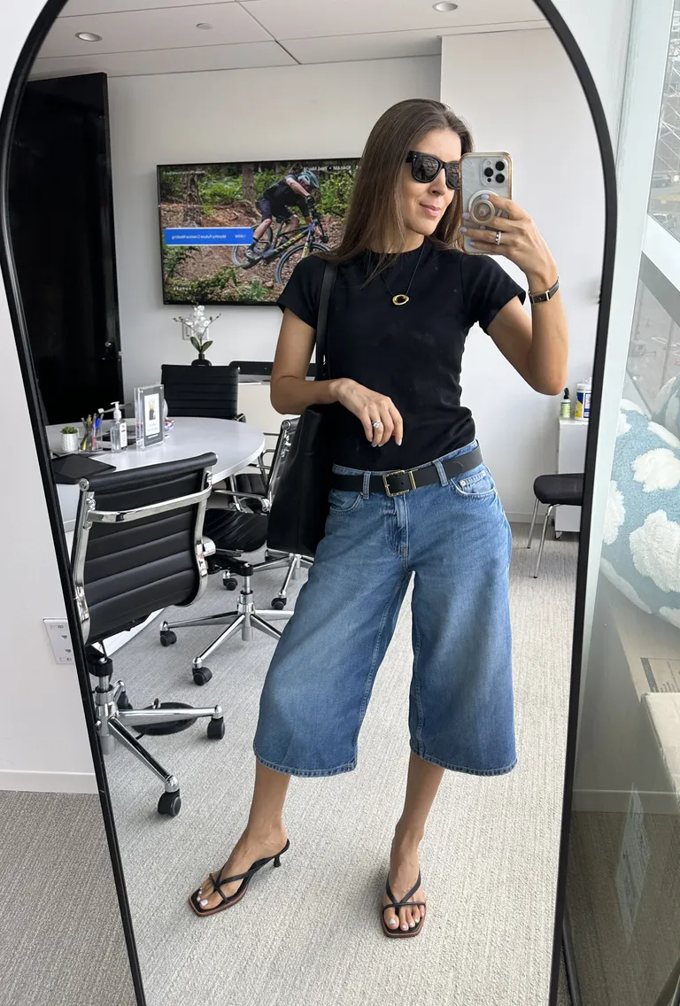 Woman in denim shorts and kitten heel sandals
