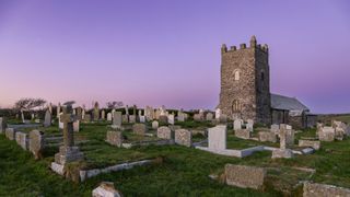 Church at sunset with purple sky