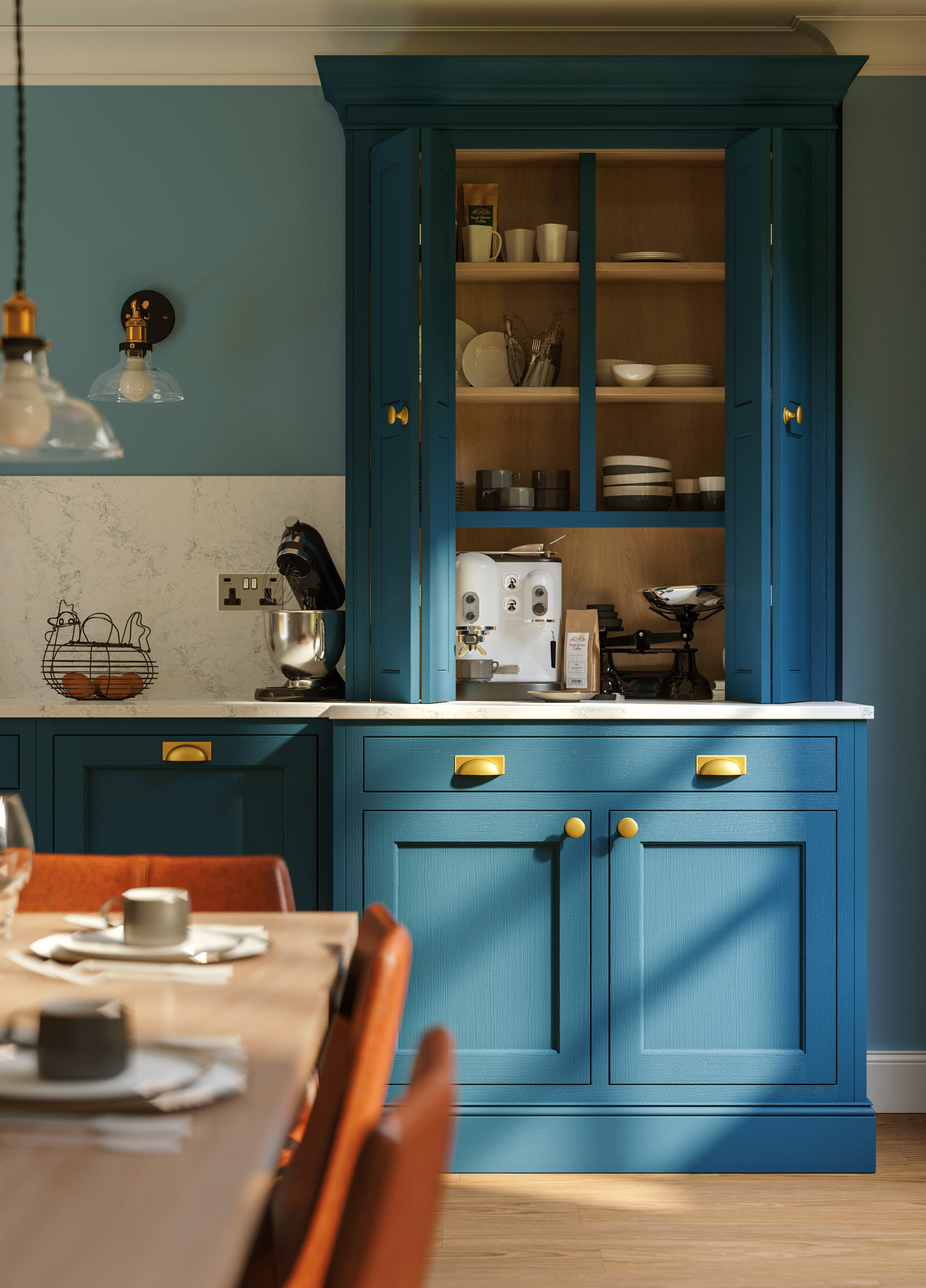 Petrol blue cabinets with gold handles disguising a small pantry