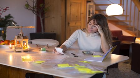 woman looking at paperwork