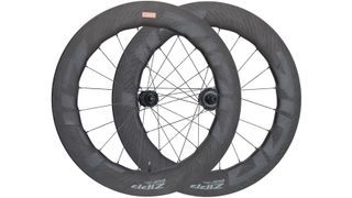 A pair of Zipp 858 NSW wheels sit on a white background