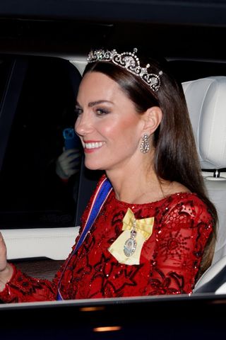 Kate Middleton headshot with a straight hairstyle and tiara