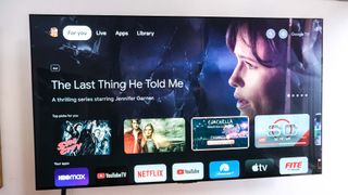 The Chromecast with Google TV home screen with an ad for Apple TV Plus' The Last Thing He Told Me