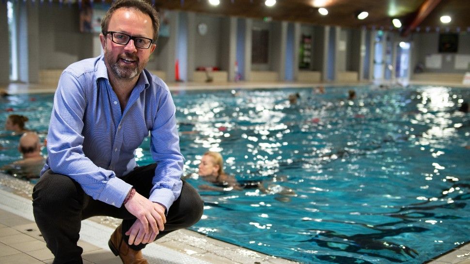 An Image of Deep Green CEO by a pool heated by servers