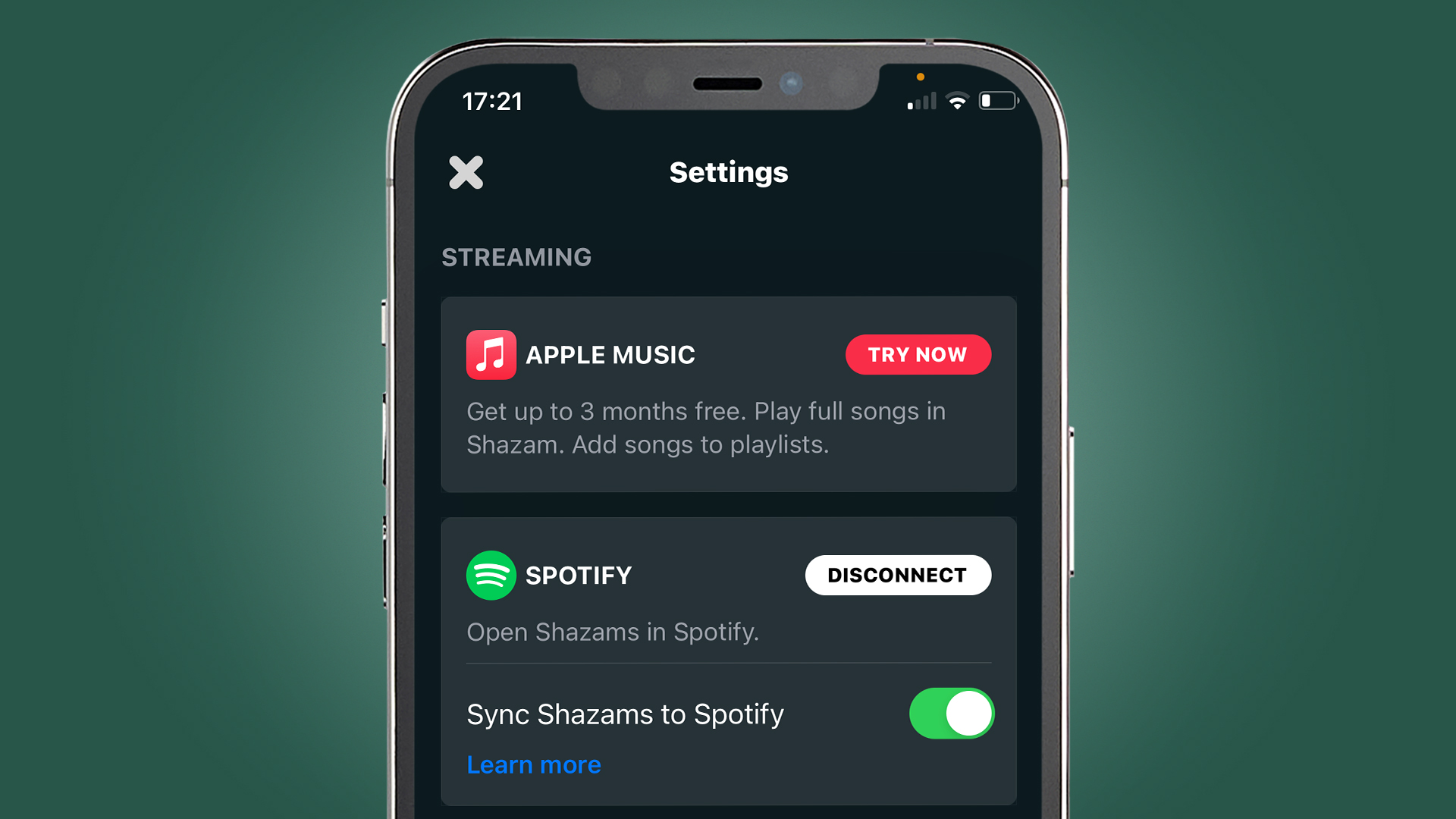 A phone screen on a green background showing the Spotify app