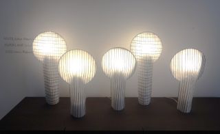 A collection of striped and checkered paper lamps by Rene Barba.