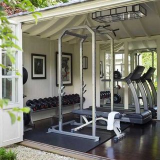 gym garage with wooden floor and gym equipment