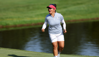 Megan Khang shouts after holing her putt