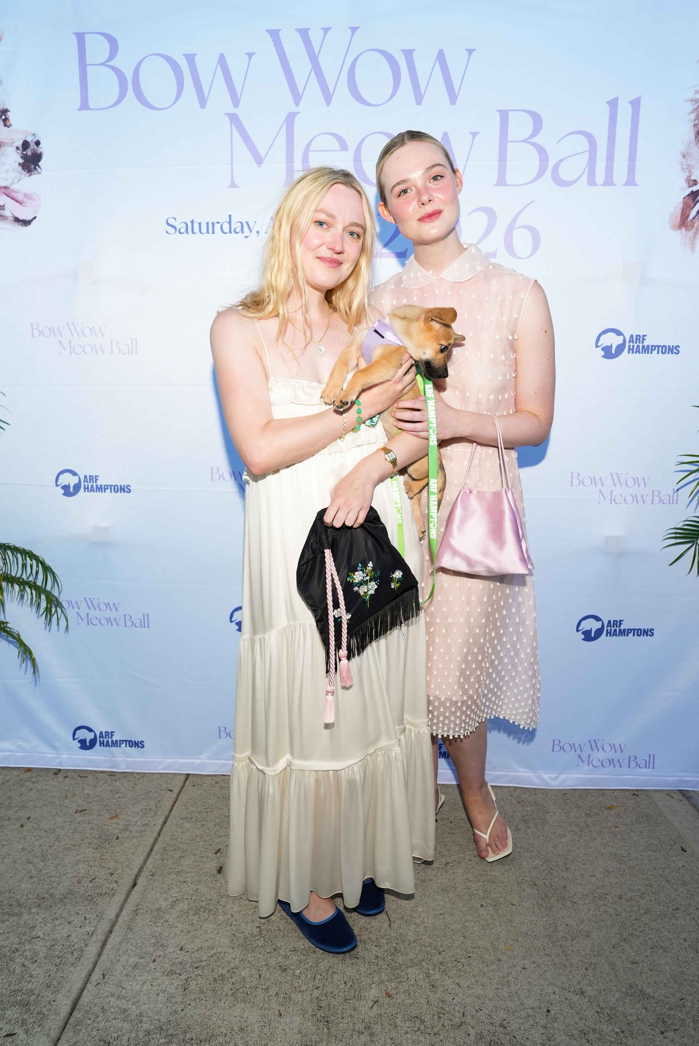 Sisters Dakota and Elle Fanning coordinated in the slouchy pouch bag trend