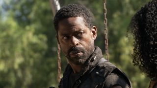 Xavier sitting on swingset talking to Teri in Paradise Season 2