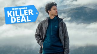 A man wearing the Arc'teryx Gamma jacket with the Tom's Guide killer deals badge