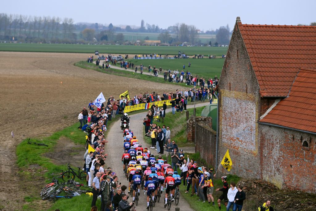 ROUBAIX FRANCE APRIL 09 A general view of the peloton passing through the Orchies cobblestones sector during the 120th ParisRoubaix 2023 Mens Elite a 2566km one day race from Compigne to Roubaix on UCIWT April 09 2023 in Roubaix France Photo by Tim de WaeleGetty Images