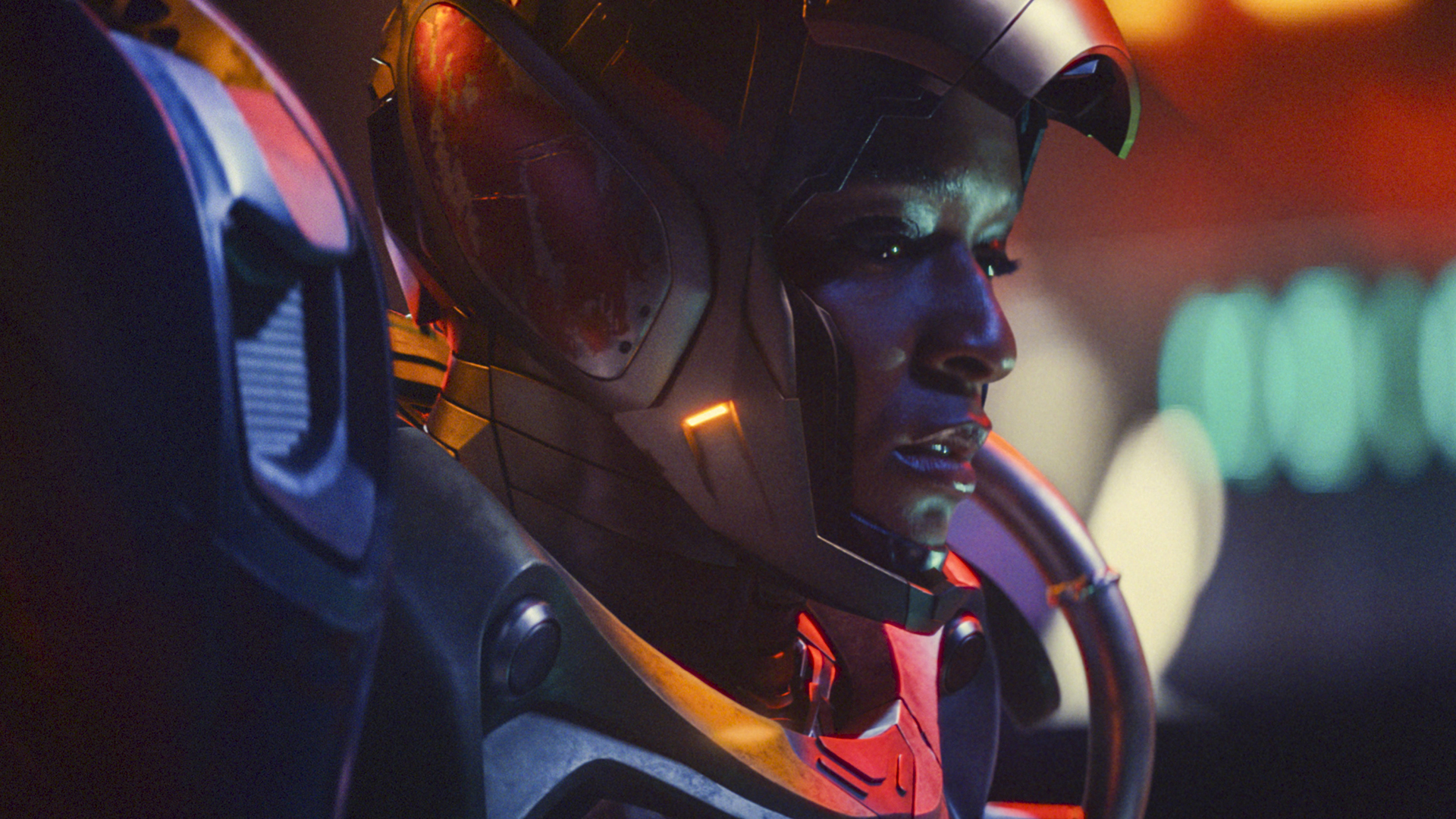 A close up of Riri Williams with her supersuit's mask open to show her face in Ironheart on Disney+