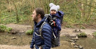 Man carrying child in Little Life Cross Country S4 carrier