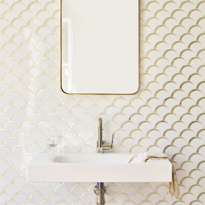 tiles in a bathroom with mirror and basin