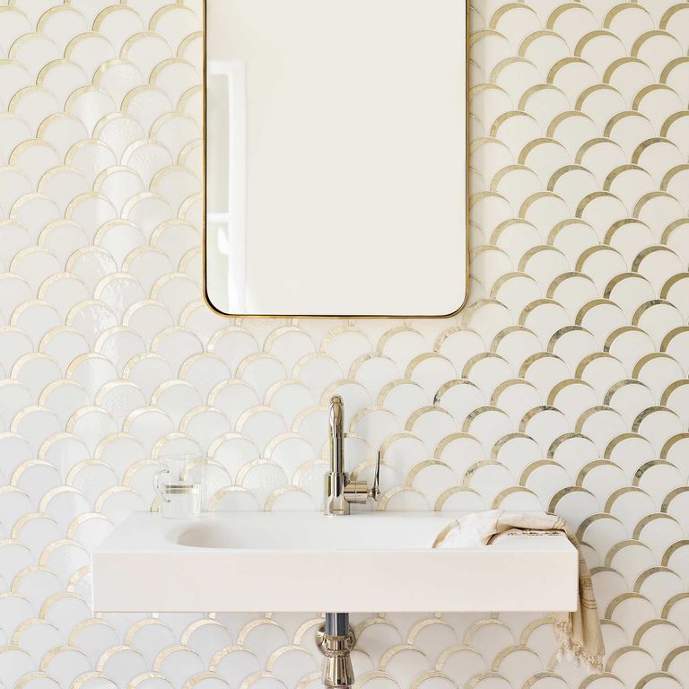 tiles in a bathroom with mirror and basin