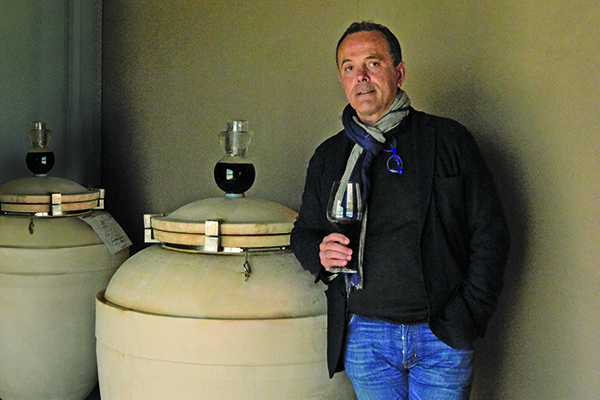 Stefano-Casadei-of-Olianas-with-some-of-his-clay-amphorae-credit-manconi-gianfranco.jpg