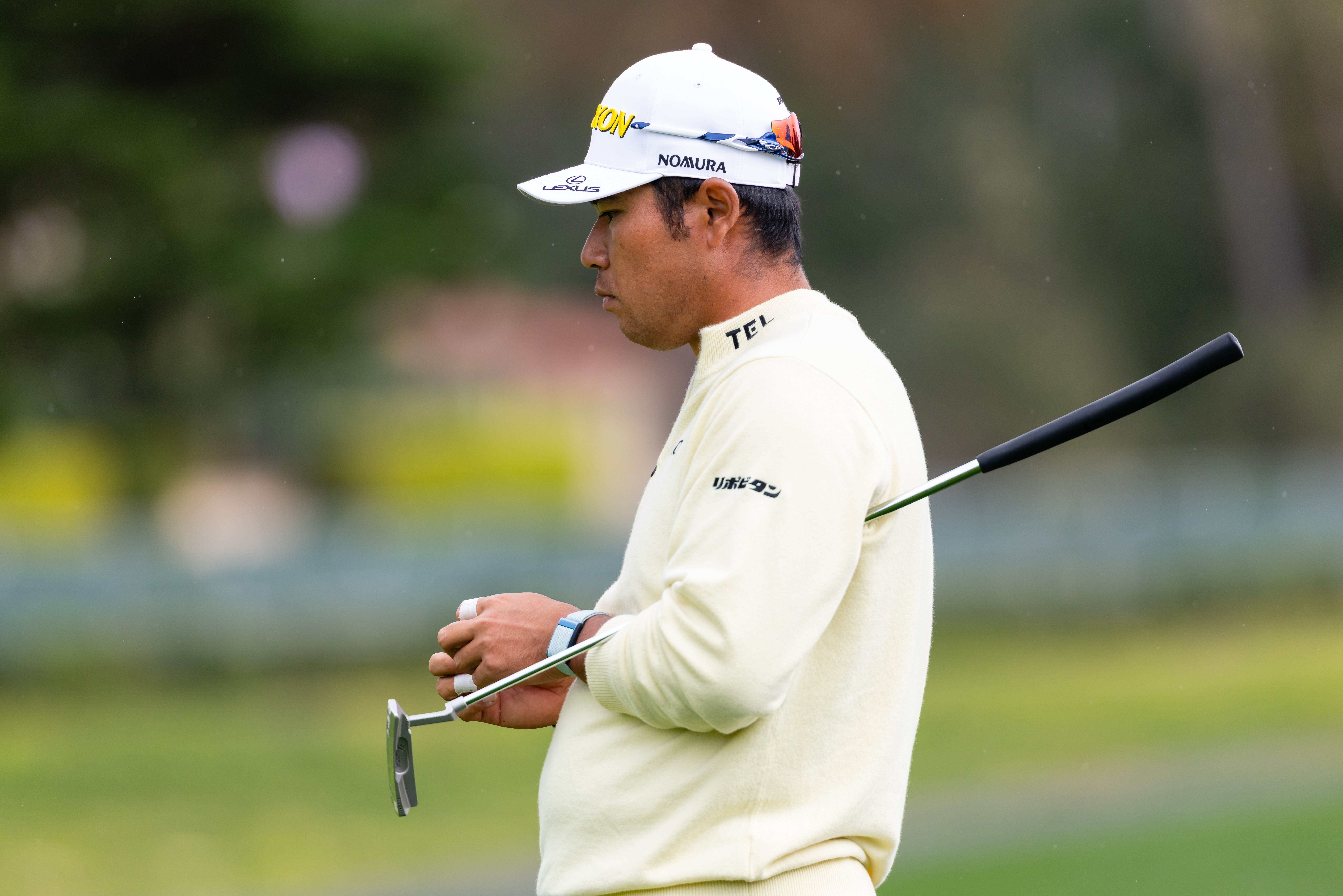 Hideki Matsuyama watches a putt