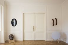 Living room door and walls all painted white in eggshell finish