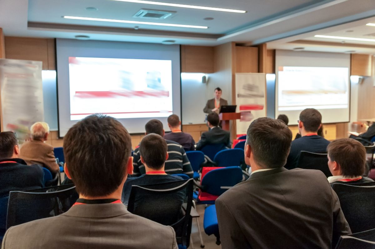 People in a conference room watching a presentation