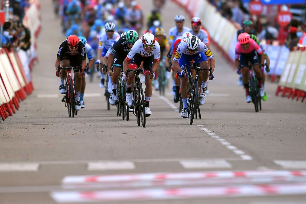 EJEADELOSCABALLEROS SPAIN OCTOBER 23 Sprint Arrival Sam Bennett of Ireland and Team Deceuninck QuickStep Jasper Philipsen of Belgium and UAE Team Emirates Jakub Mareczko of Italy and CCC Team during the 75th Tour of Spain 2020 Stage 4 a 1917km stage from Garray Numancia to Ejea de los Caballeros lavuelta LaVuelta20 La Vuelta on October 23 2020 in Ejea de los Caballeros Spain Photo by Justin SetterfieldGetty Images